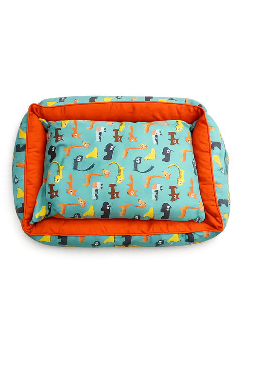 Teal rectangular pet bed by Loom and Latch with soft fabric and animal print design for comfortable everyday pet relaxation.