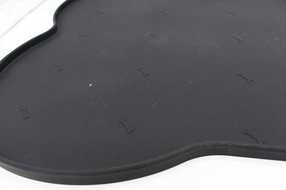 Silicone anti-spill pet feeding mat in waterproof, non-slip bone shape by Loom and Latch, designed to keep bowls in place.