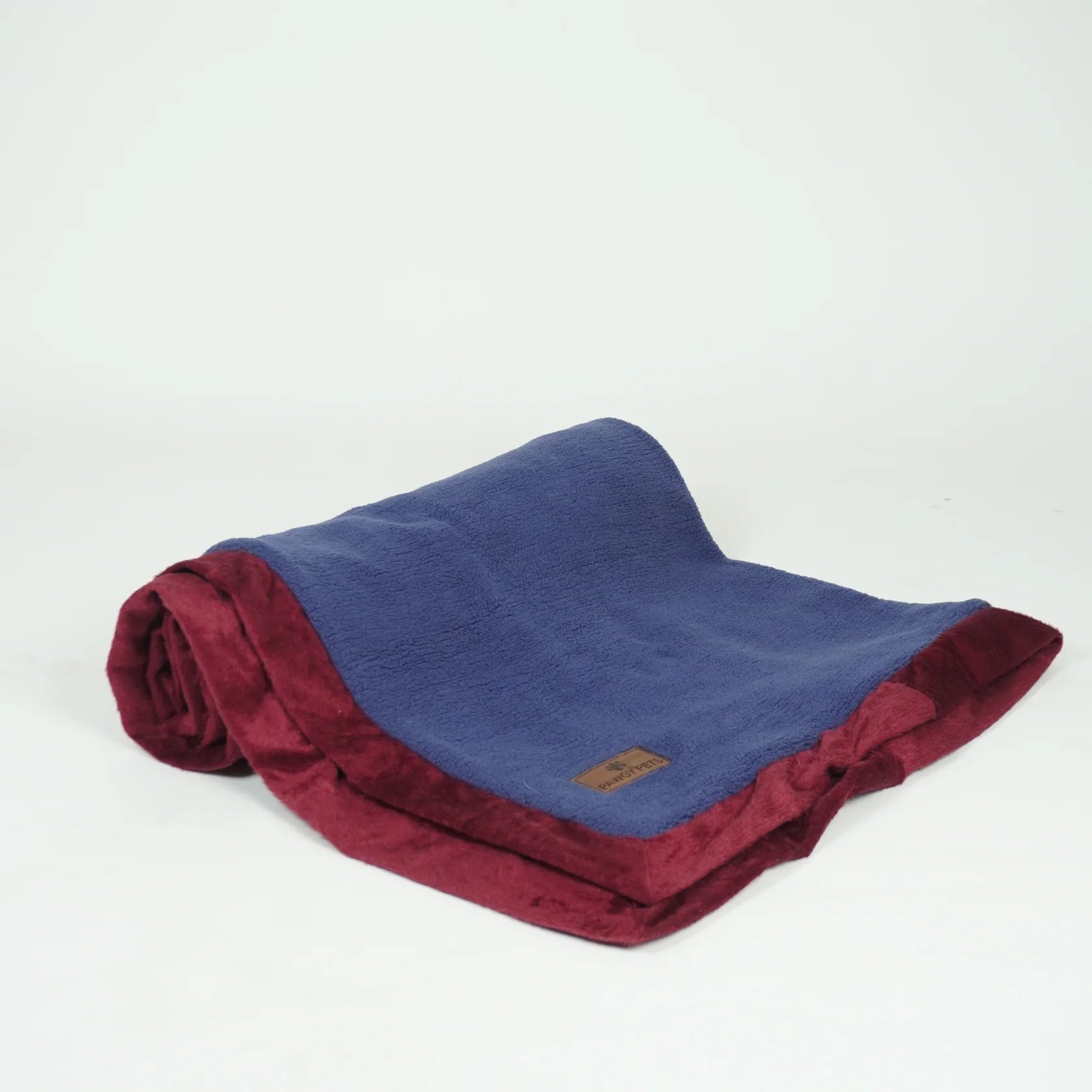 Reversible Loom and Latch pet blanket in grey and maroon, soft furry comfort for dogs and cats, shown folded with plush texture.