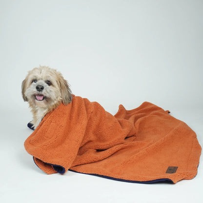Reversible pet blanket by Loom and Latch, navy and rust soft furry blanket for dogs and cats, comfortable and cozy.